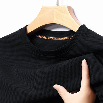 Close-up of men's premium textured short-sleeve t-shirt fabric, showcasing quality & everyday comfort.