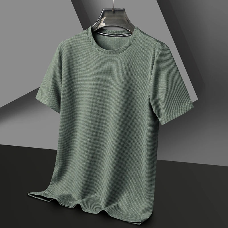 Back view of men's premium textured short-sleeve t-shirt, highlighting relaxed fit & casual style.