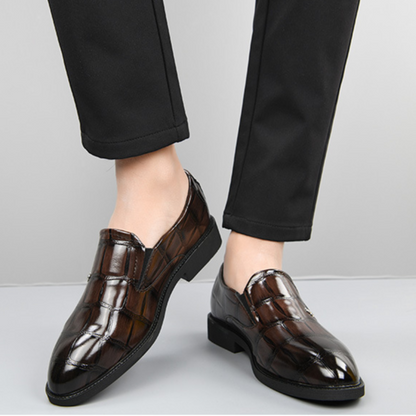 Detail of the durable sole on men's lightweight slip-on loafers, ensuring comfort & grip for business wear.