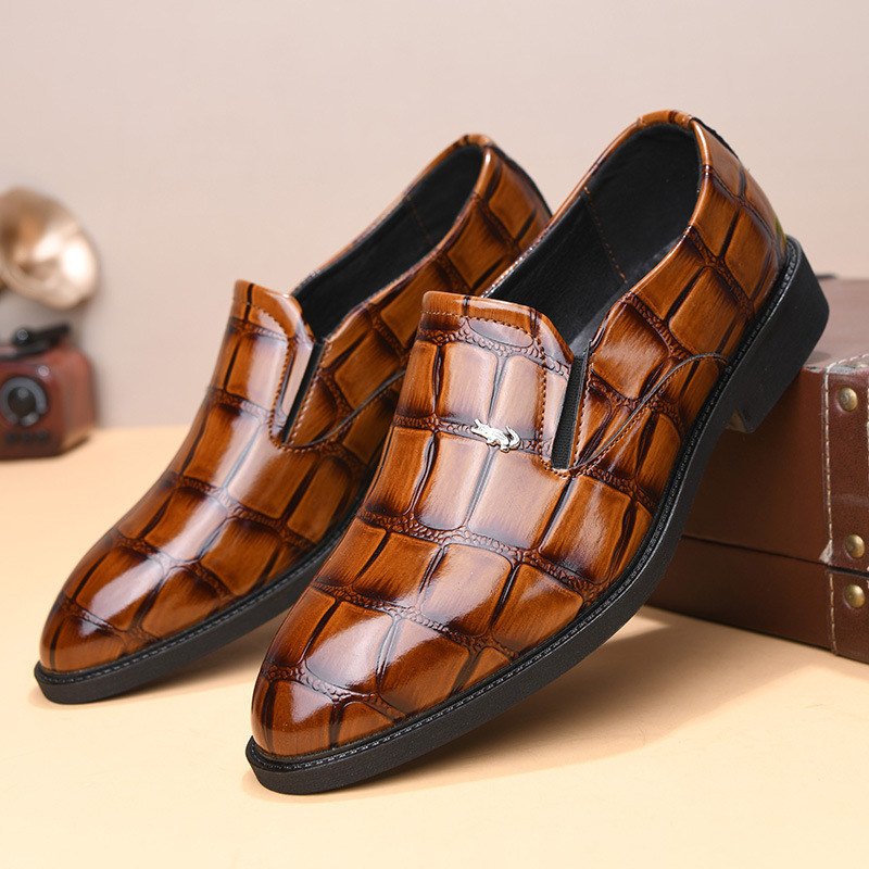 Modern mens formal loafers paired with a suit, creating a sharp & professional business look. Slip-on style.