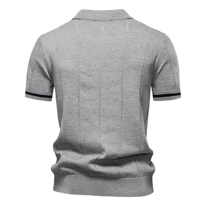 Men's quarter-zip polo with structured collar, offering a smart casual look & comfortable fit. Cotton blend.