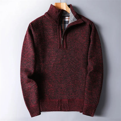 Close-up of quarter-zip & turtleneck collar on men's warm sweater, emphasizing quality detail.