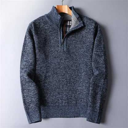 Men's quarter-zip turtleneck sweater worn outdoors, emphasizing warmth, rugged style & winter fashion.