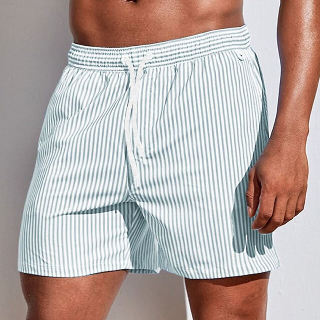 Comfortable men's quick-dry striped swim trunks, ideal for active summer wear & vacation comfort.