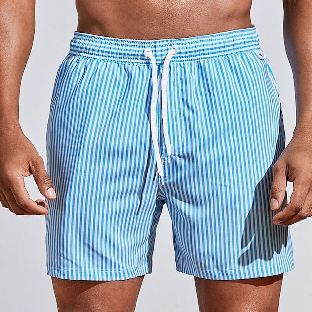 Striped men's quick-dry swim trunks. Comfortable beachwear with an adjustable drawstring.