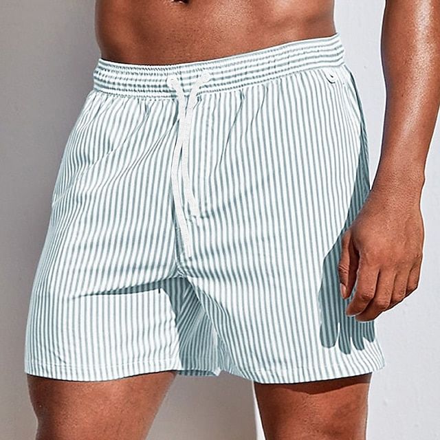 Stylish men's quick-dry swim trunks. Perfect athletic shorts for summer and resort wear.