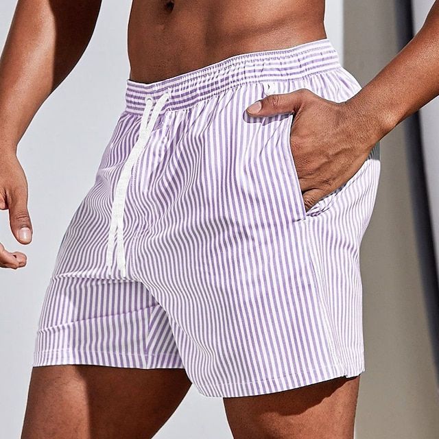 Quick-dry men's swim trunks featuring adjustable drawstring for a secure fit. Great for swimming.