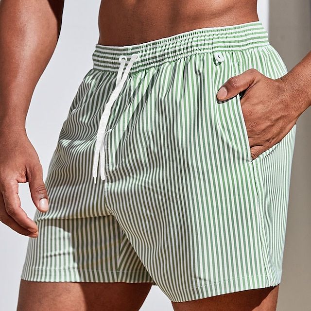 Striped quick-dry men's swim trunks. Essential beachwear for summer vacation.