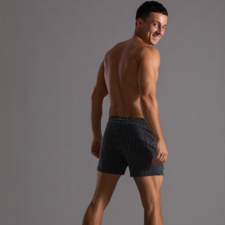 Men's vacation swim shorts, quick-drying, stylish beach & pool apparel.