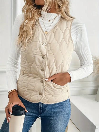 Stylish men's quilted vest, bomber style, featuring cozy sherpa lining. Ideal lightweight layering piece.