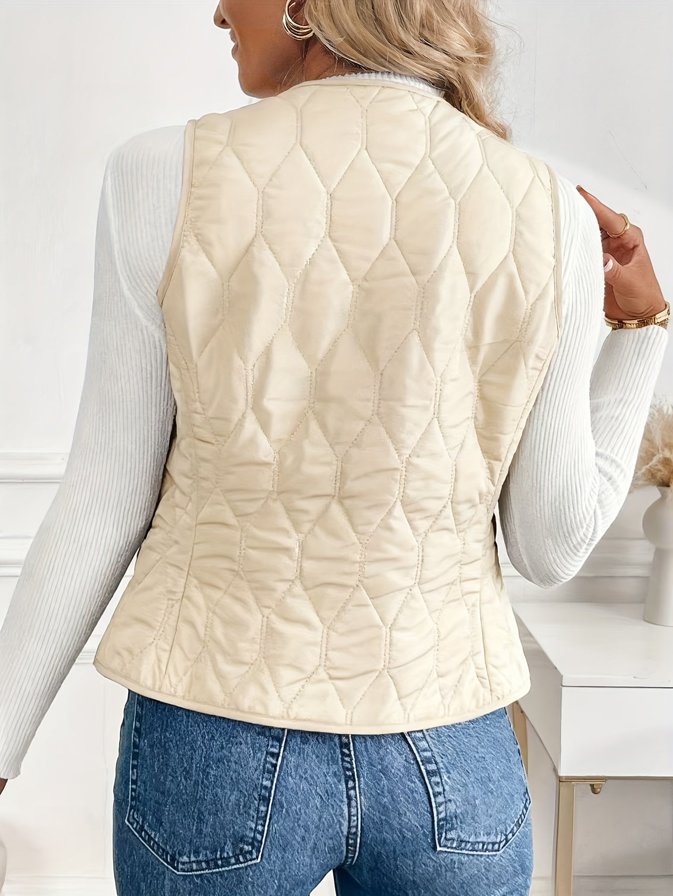 Front view of a versatile men's bomber vest. Features a diamond quilt pattern & warm sherpa lining.