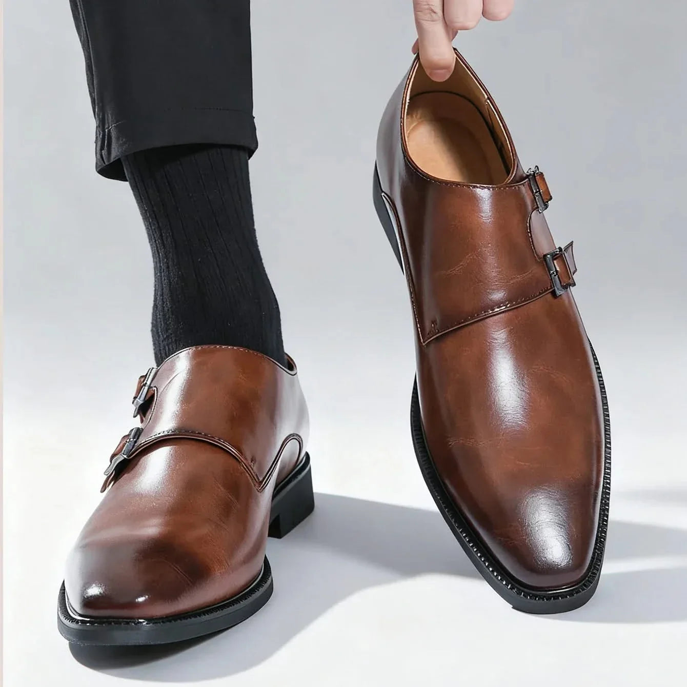 Comfortable Men's Regent Monk Loafers in black leather, offering sleek style for professional or elegant occasions.