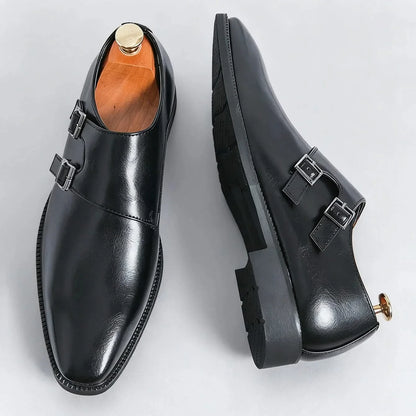 Men's black leather Regent Monk Loafers worn on foot, showcasing elegant style and all-day comfort for professionals.