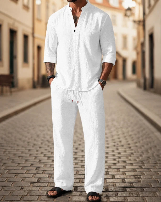 Casual men's 2-piece outfit set, relaxed fit shirt & pants, ideal travel wear for summer comfort and leisure.