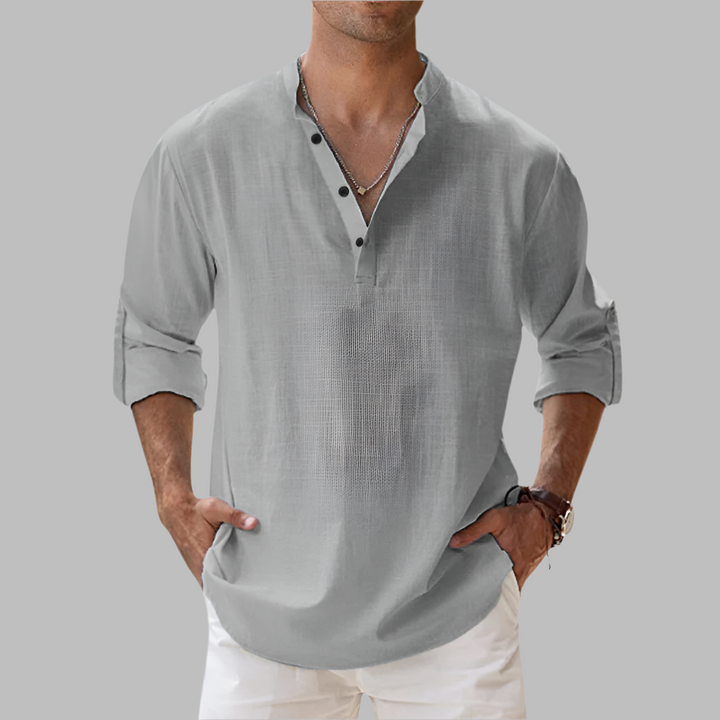 Casual men's button-down shirt with a band collar & relaxed fit, ideal for summer style & versatility.