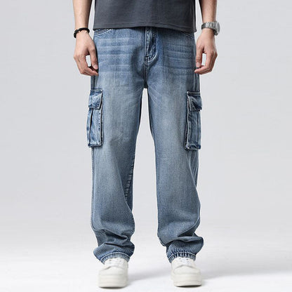 Street style men's relaxed fit cargo jeans, featuring deep utility pockets for a modern urban look.