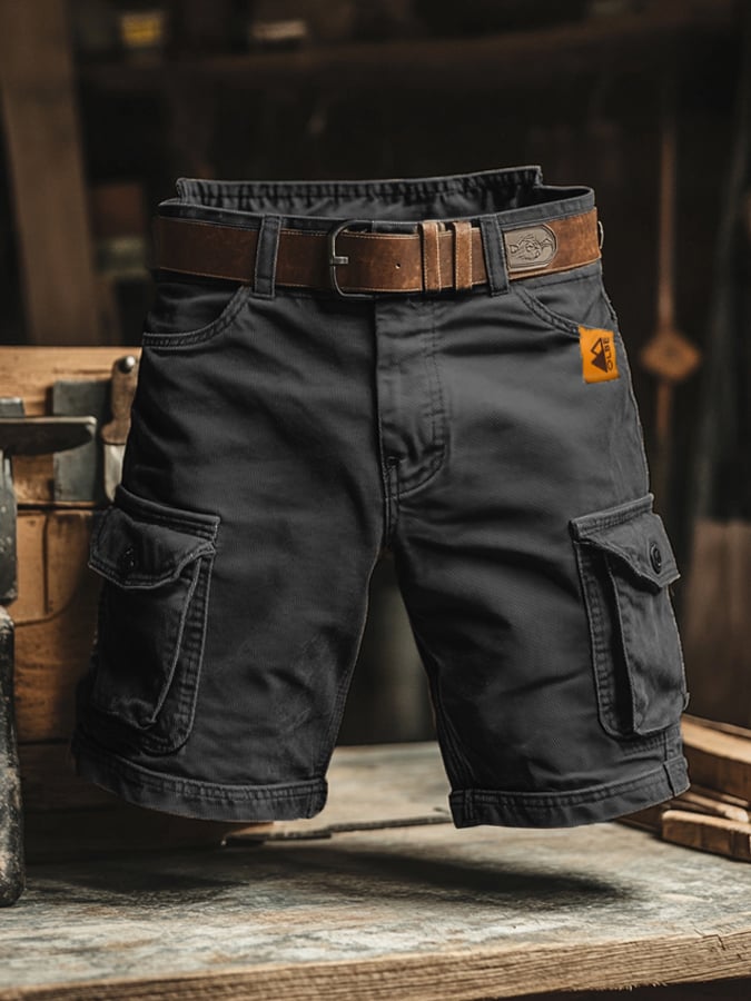Men's relaxed fit cargo pants with multiple functional utility pockets in durable fabric, ideal for casual outdoor wear.