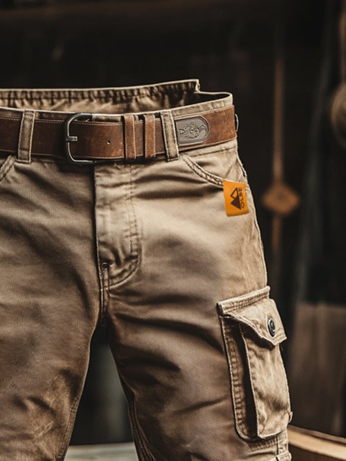 Black men's relaxed fit cargo pants with durable fabric & multiple functional utility pockets for casual autumn wear.