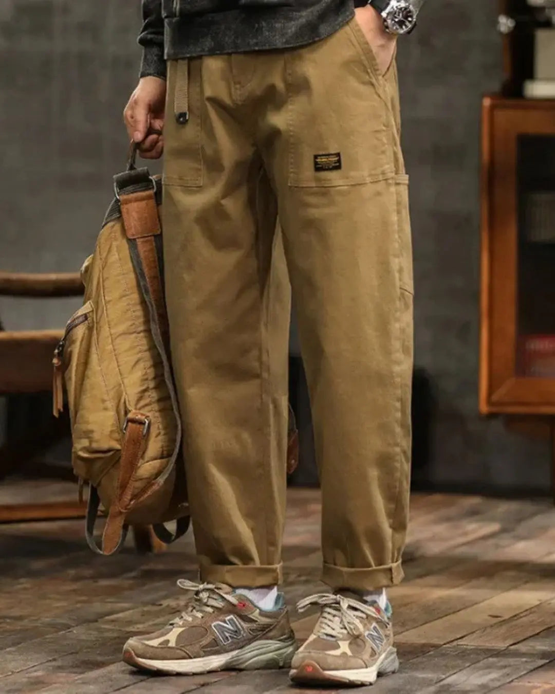 Black men's relaxed fit cargo trousers featuring multi-functional utility pockets for versatility.