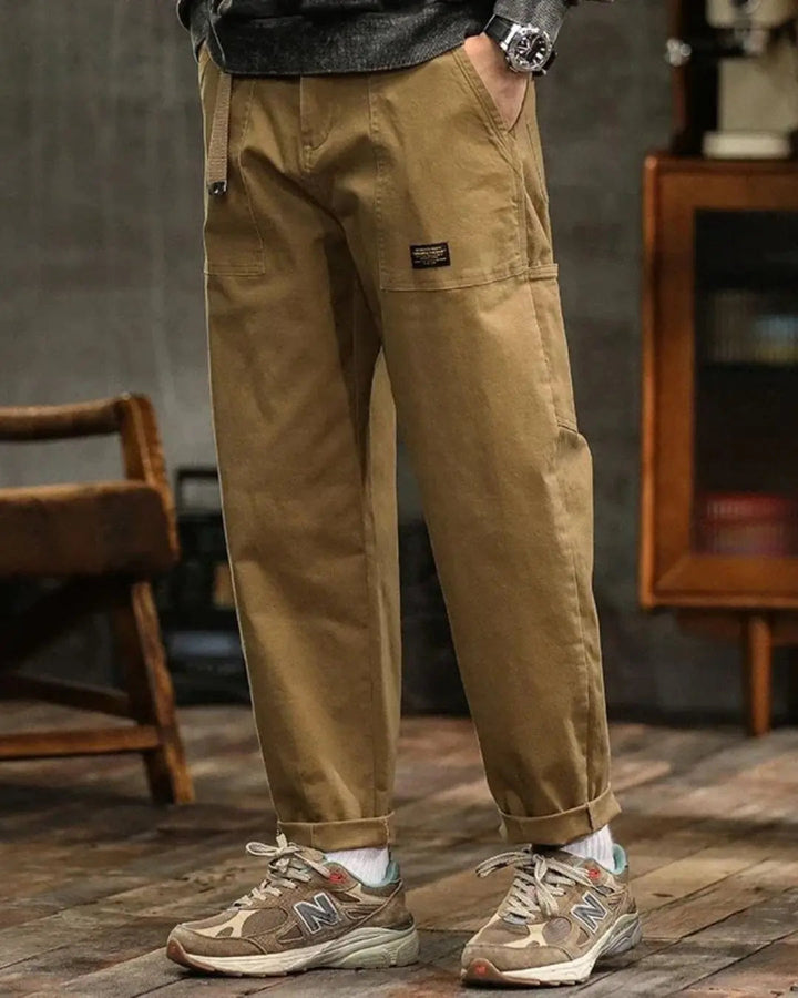 Comfortable men's relaxed fit cargo pants in blue, designed for casual style & outdoor activities.