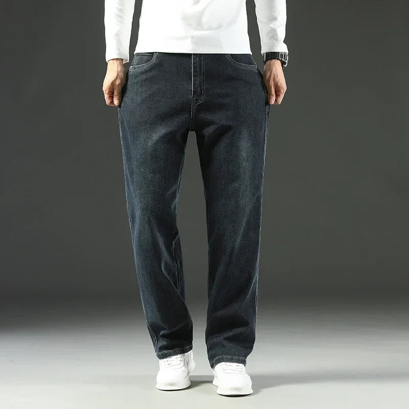 Man wearing versatile men's carpenter jeans, relaxed fit & durable for active workwear or casual adventures.