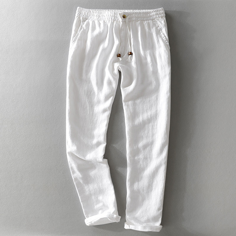 Stylish men's relaxed fit casual pants, versatile for summer fashion. Breathable fabric, easy wear.