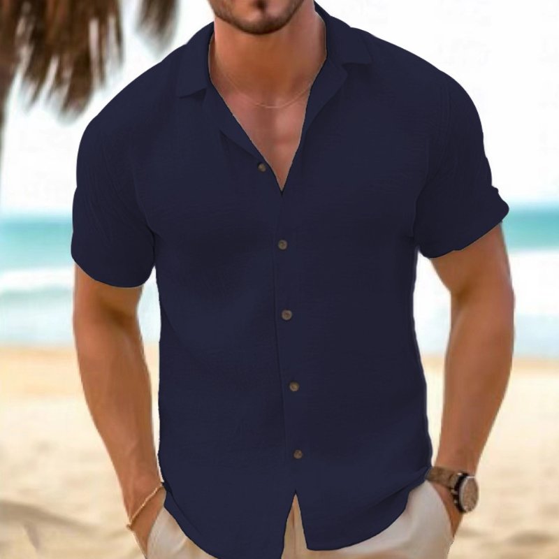 Model wearing a men's relaxed fit short sleeve casual shirt, perfect for summer comfort.