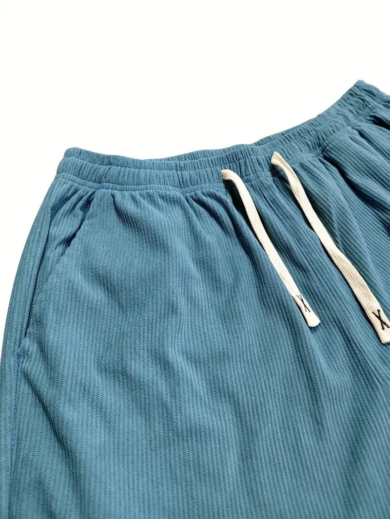 Green men's relaxed fit trousers, straight leg for comfort, suitable for work & casual wear.