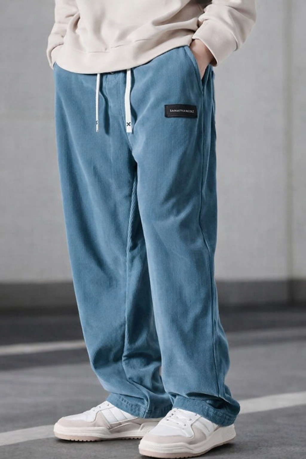 Black men's relaxed fit trousers with adjustable waist, perfect for daily routine and work.