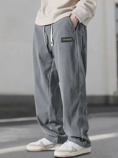 Green straight-leg casual pants for men, offering relaxed fit and versatile everyday style.