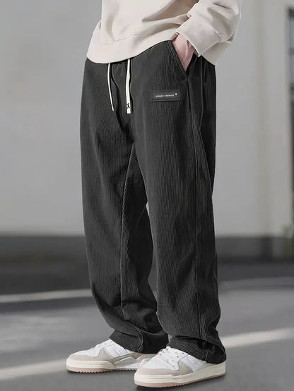 Men's versatile black relaxed fit trousers, perfect for everyday style & work comfort.