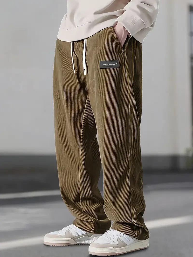 Beige men's casual pants, relaxed fit straight leg for comfort and daily wear.