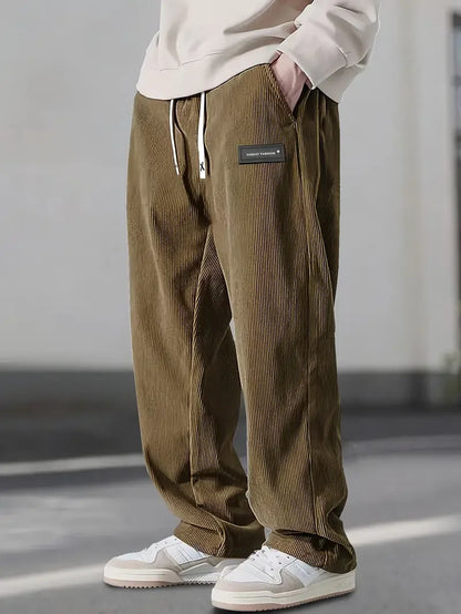 Beige men's casual pants, relaxed fit straight leg for comfort and daily wear.