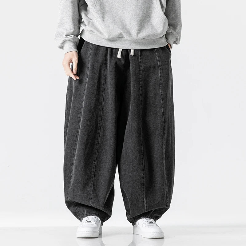 Light blue men's relaxed fit jogger pants, ideal for active leisure & comfy street style. Features adjustable waist.