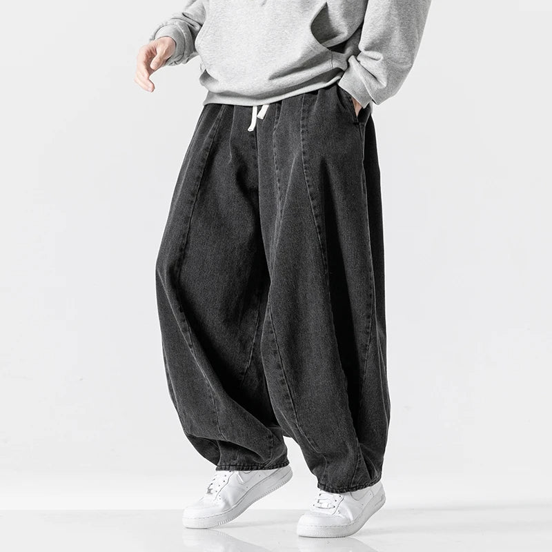 Dark blue men's relaxed fit joggers with adjustable waist, great for casual outings & comfy, modern street look.