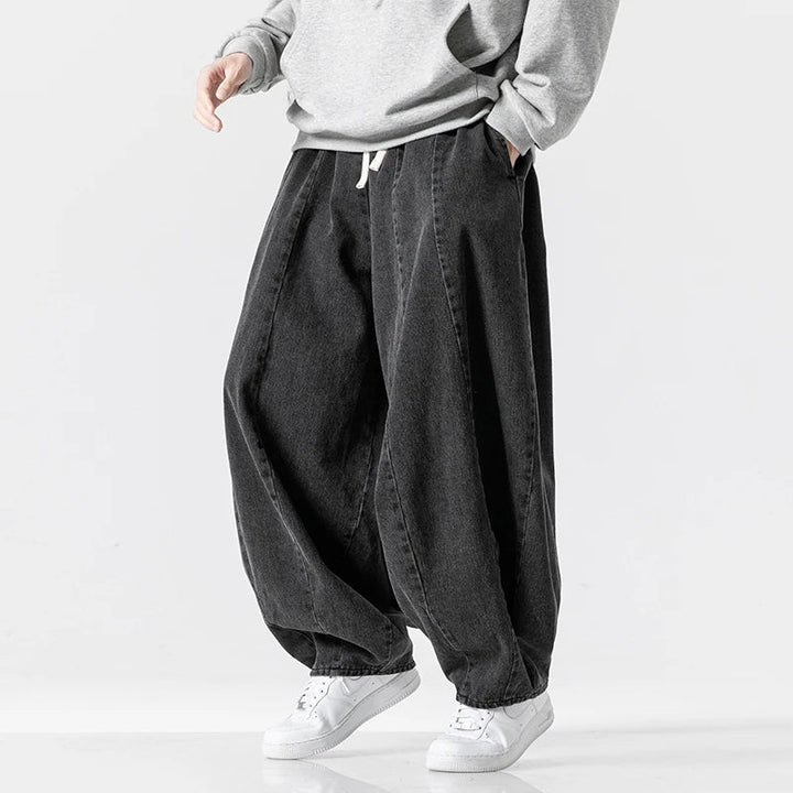 Dark blue men's relaxed fit joggers with adjustable waist, great for casual outings & comfy, modern street look.