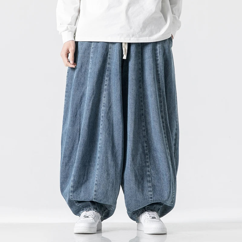 Relaxed fit dark blue men's joggers, offering comfort & style. Casual pants with an adjustable waist for daily wear.