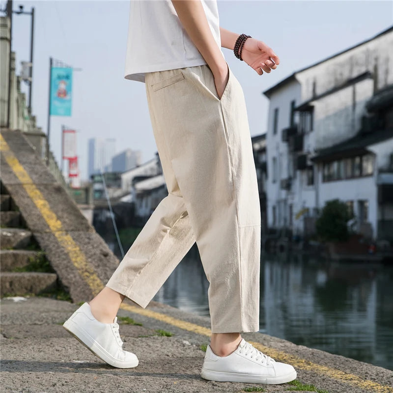 Relaxed fit men's comfort pants with a drawstring waist, perfect for versatile, breathable everyday fashion.