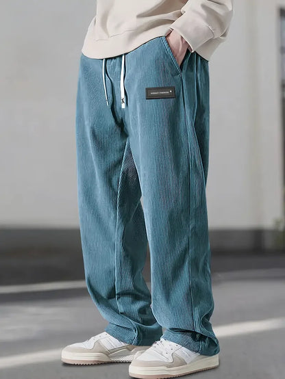 Urban style men's corduroy cargo pants with multiple pockets, full length, perfect for streetwear.