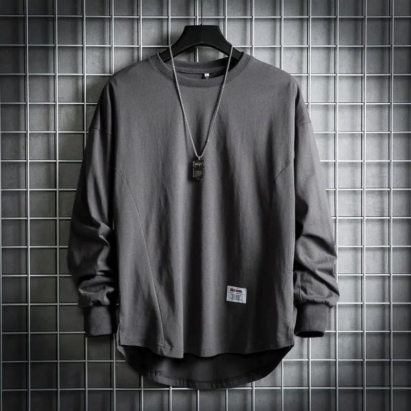 Men's relaxed fit crewneck pullover with drop hem. Soft, comfortable long sleeve for casual everyday wear.