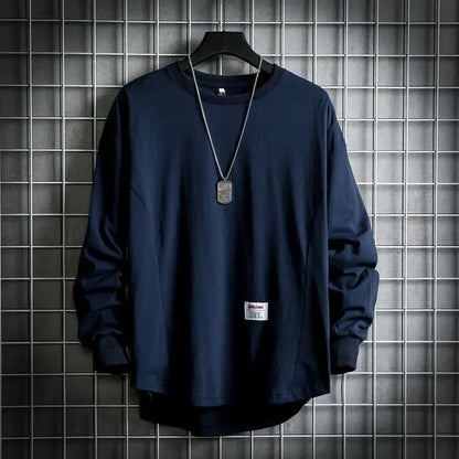 Modern men's drop hem pullover, versatile long sleeve crewneck for layering & casual style.