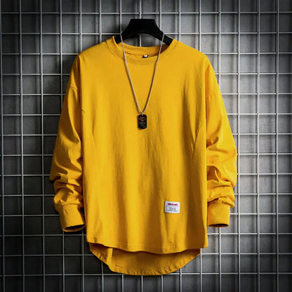 Soft men's long sleeve drop hem pullover. Comfortable crewneck top, ideal for modern everyday casual wear.