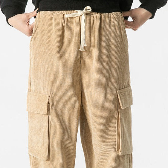 Black men's relaxed fit cargo pants with drawstring, designed for casual versatility.