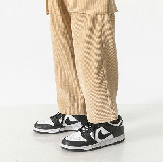 Khaki men's versatile cargo pants, featuring a drawstring waist & relaxed fit for daily comfort.