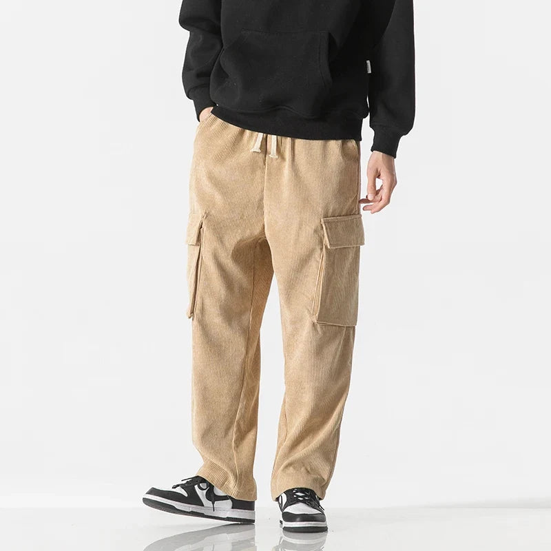 Dark grey drawstring cargo pants for men, featuring a relaxed fit & practical pockets.