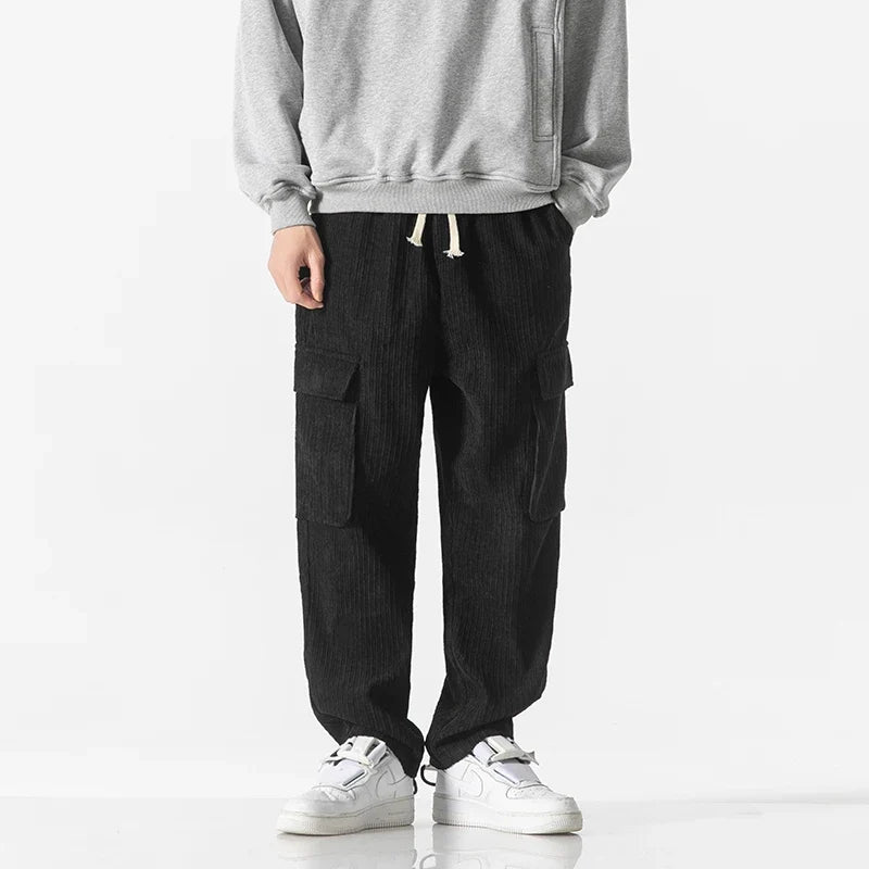 Black men's cargo pants with a drawstring waist, perfect for comfortable casual wear.
