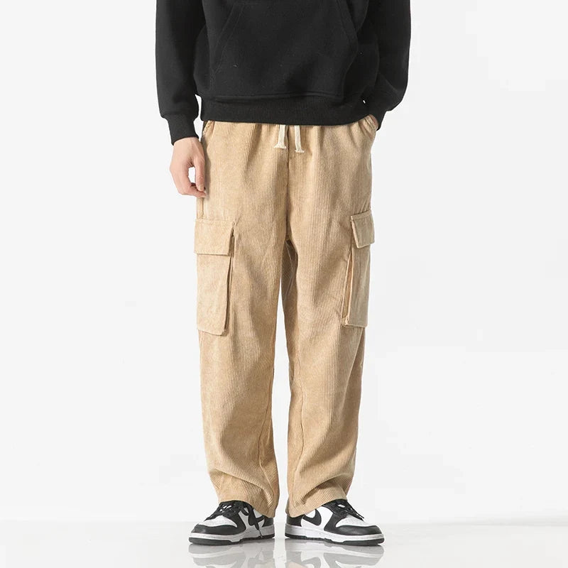 Dark grey men's casual cargo bottoms, featuring a drawstring closure & practical design.