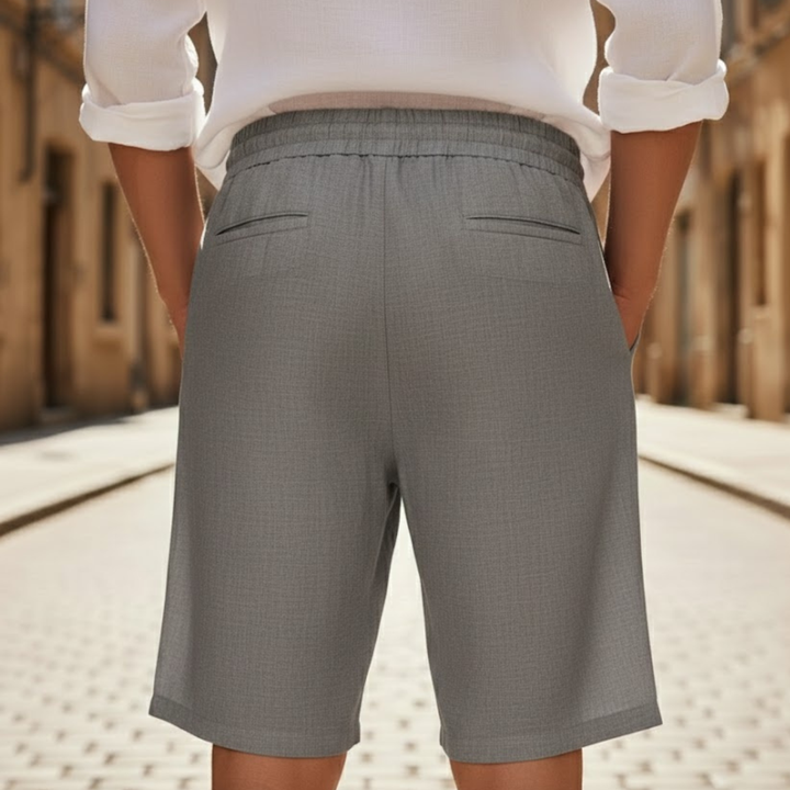 Comfortable men's knee-length drawstring shorts in a relaxed fit for versatile summer everyday wear.
