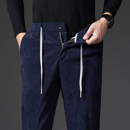 Man wearing stylish relaxed fit everyday pants, showcasing their comfortable and versatile design.