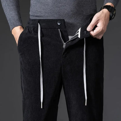 Elastic waist men's drawstring pants, relaxed fit, designed for comfortable everyday wear and casual style.